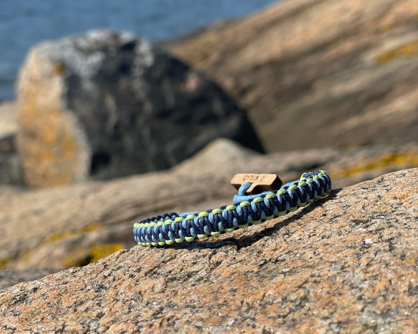 Bracelet on a rock with blurred natural background. 
